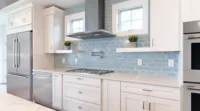 22719753_thermador-luxury-kitchen-appliance-packages-gas-cooktop-white-blue-subway-tile-kitchen_2640x1465.webp