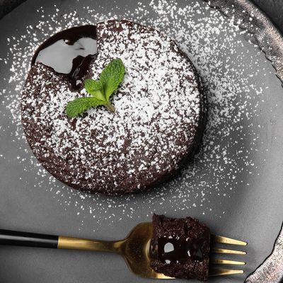 Dark chocolate and stout fondant on a plate.