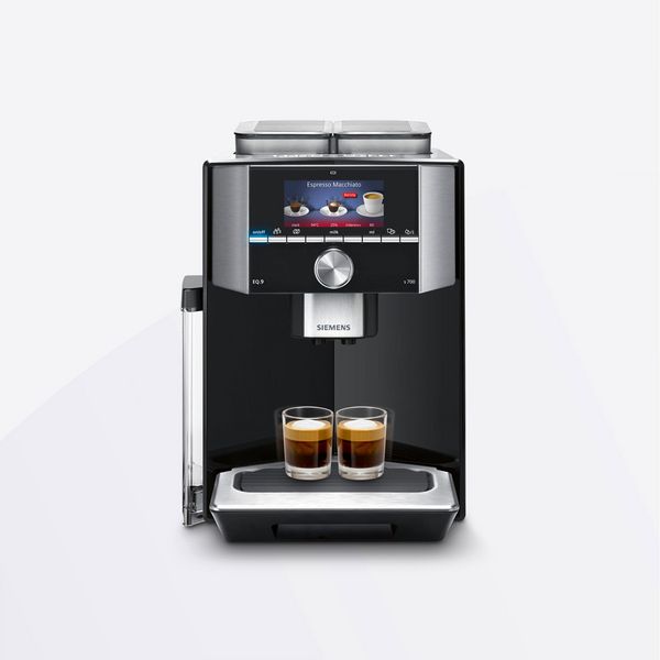 Imaginea produsului afișează un aparat pentru cafea cu două cești pline de cafea.