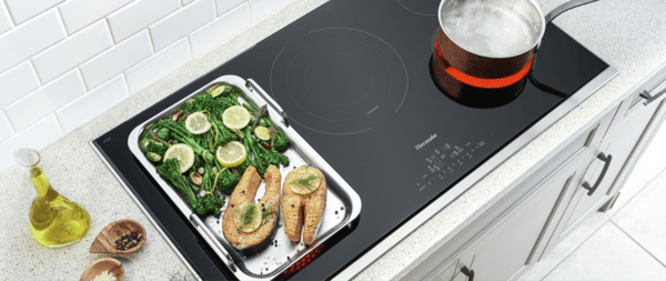 thermador electric cooktops overhead shot with boiling pot and food