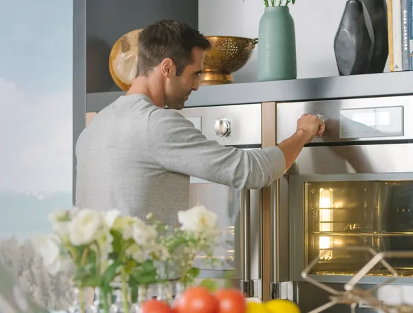Man interacting with Thermador Wall Oven