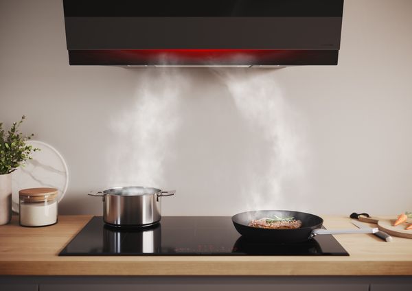 An atmospherically lit extractor hood with the Home Connect function
