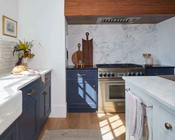 Navy and oak kitchen with Thermador Range - The Sip & Ski Lodge