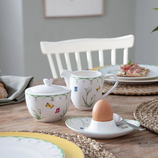 white spring floral dishes with egg cup on table