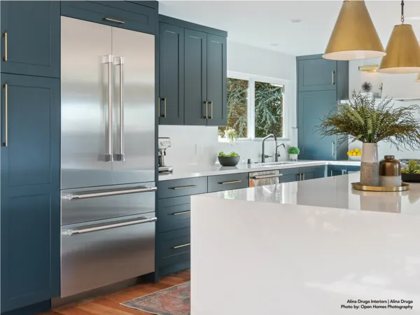 Thermador Bottom Mount Freezers in blue gold kitchen 