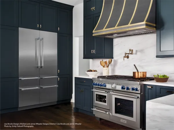dark navy gold kitchen with thermador appliances