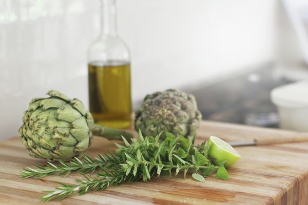 Vegetables, herbs and olive oil as ingredients of a tasty dish