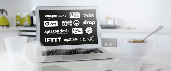 Laptop with logos of Home Connect partners such as IFTTT, Amazon Alexa, Senic, My Taste, Bosch Smart Home and many more