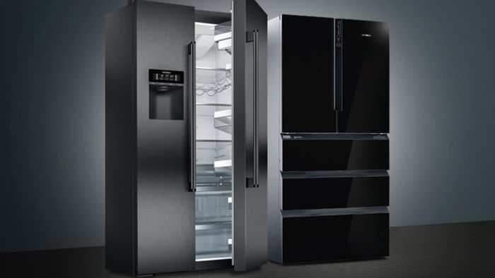 Two large freestanding fridge freezers