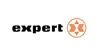 Das Bild zeigt das in schwarzem Text geschriebene Wort "Experte", mit einem orangen Symbol, das einem Stern oder Kompass entspricht.