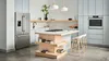 Modern kitchen with Bosch stainless steel appliances, wooden island, and pendant lighting.