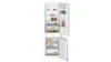 Open white refrigerator with various food items on shelves, including fruits, jars, and drinks.
