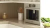 Built-in Bosch coffee machine in a modern kitchen with countertop decor.