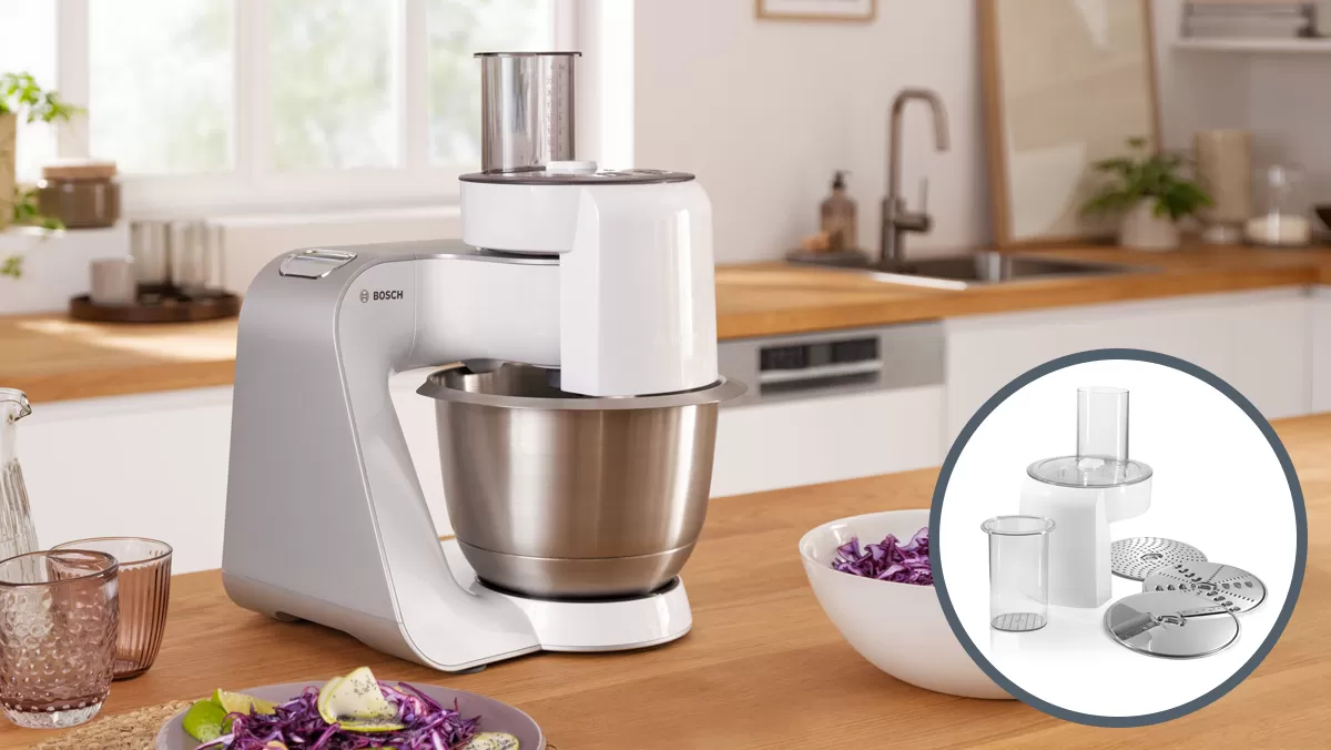 Bosch kitchen mixer on wood surface, surrounded by icons of blender, grater, juicer, and processor.