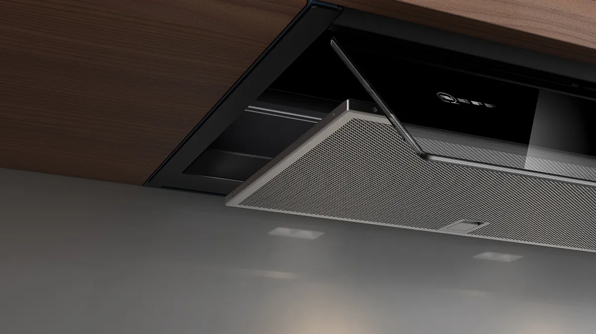 Ceiling-mounted ventilation system with black and gray components in a modern interior.