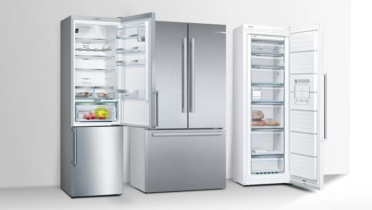 A modern refrigerator with a stainless steel finish, showcasing neatly organized food items and fresh produce inside.