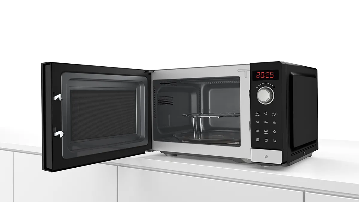 Microwave with grill and automatic settings, offering convenience with special defrost programmes for various food types.
