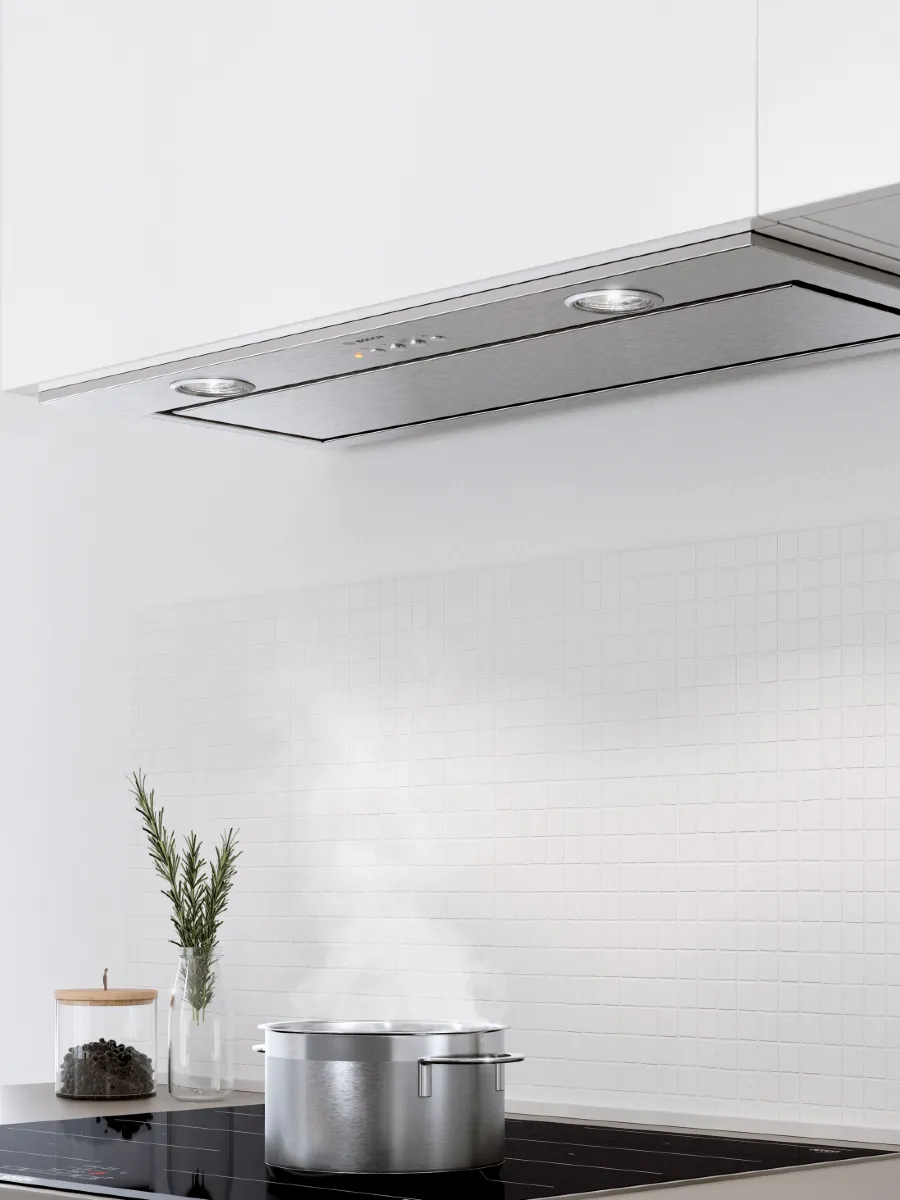 Modern kitchen with beige cabinets, wooden accents, and a dining area.