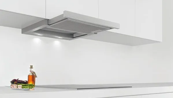 A black kitchen hood mounted above a cooktop, with a 90cm measuring scale displayed for reference.