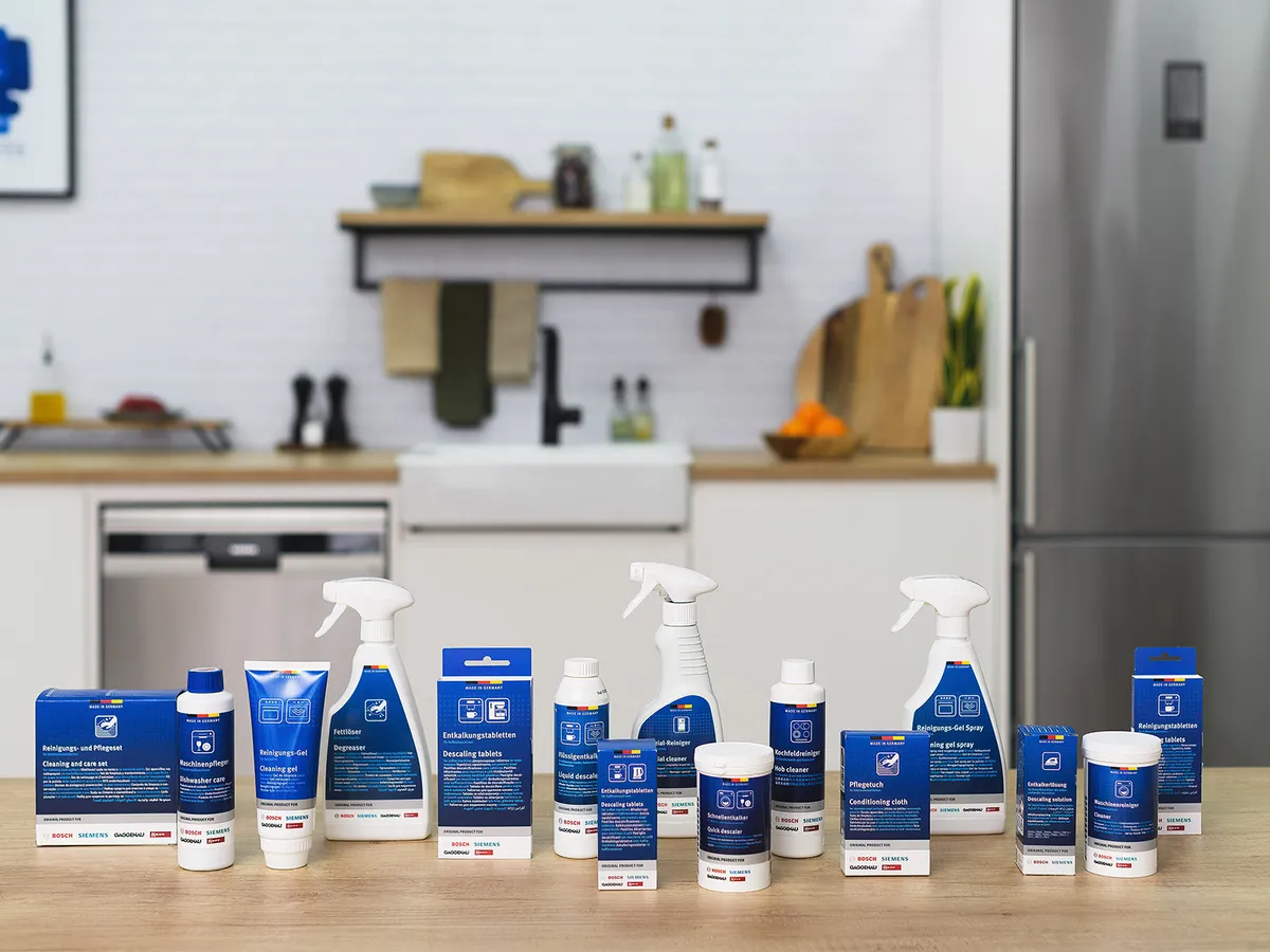 An inviting, modern kitchen full of Bosch appliances, including a big fridge-freezer with the doors open to reveal lots of food.