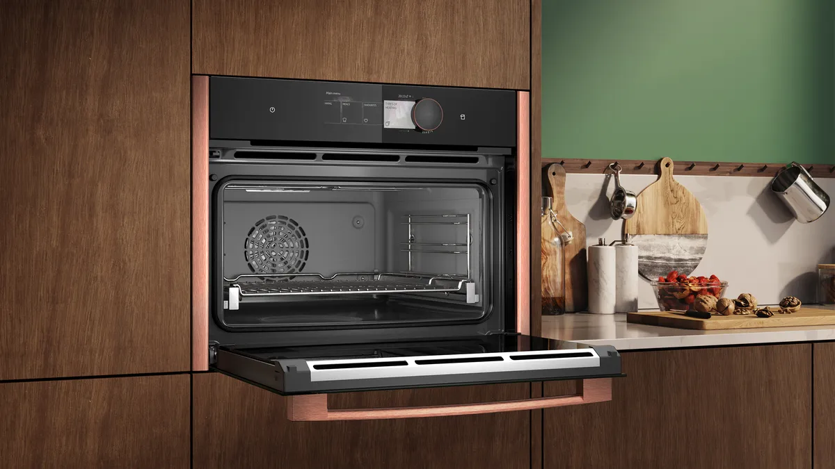Microwave Oven with Brushed Bronze side strips, shown with door open  