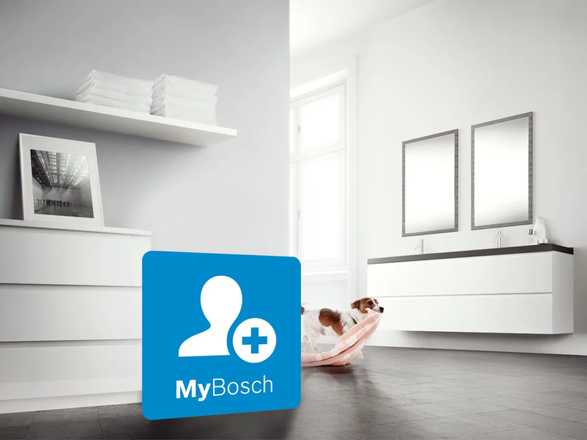 Ett vitt ljust kök med en liten hund och en blå MyBosch-logotyp i förgrunden av bilden.