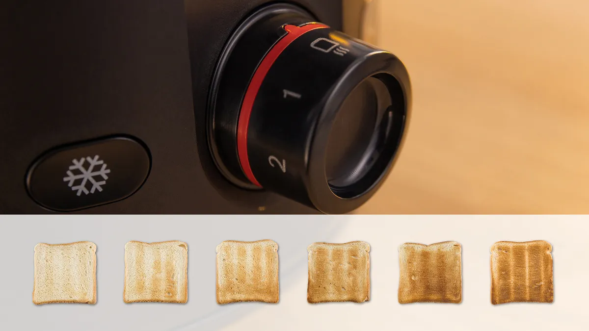 Uvećan prikaz dugmeta toster-a sa oznakama boje tosta koje variraju od svetle do tamne, plus simbol snežne pahulje za odmrzavanje.