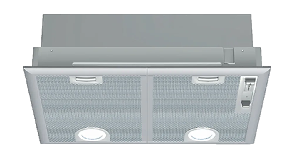 This image showcases a built-in kitchen hood with a minimalist design, characterized by a sleek, flat glass panel featuring mesh filters. The hood is mounted flush with the cabinetry, providing a seamless look in the kitchen. It includes integrated lights on either side, enhancing visibility while cooking. Control buttons for operating the ventilation are conveniently located on the side, allowing for easy access. This design blends functionality with modern aesthetics, making it an appealing option for contemporary kitchens.