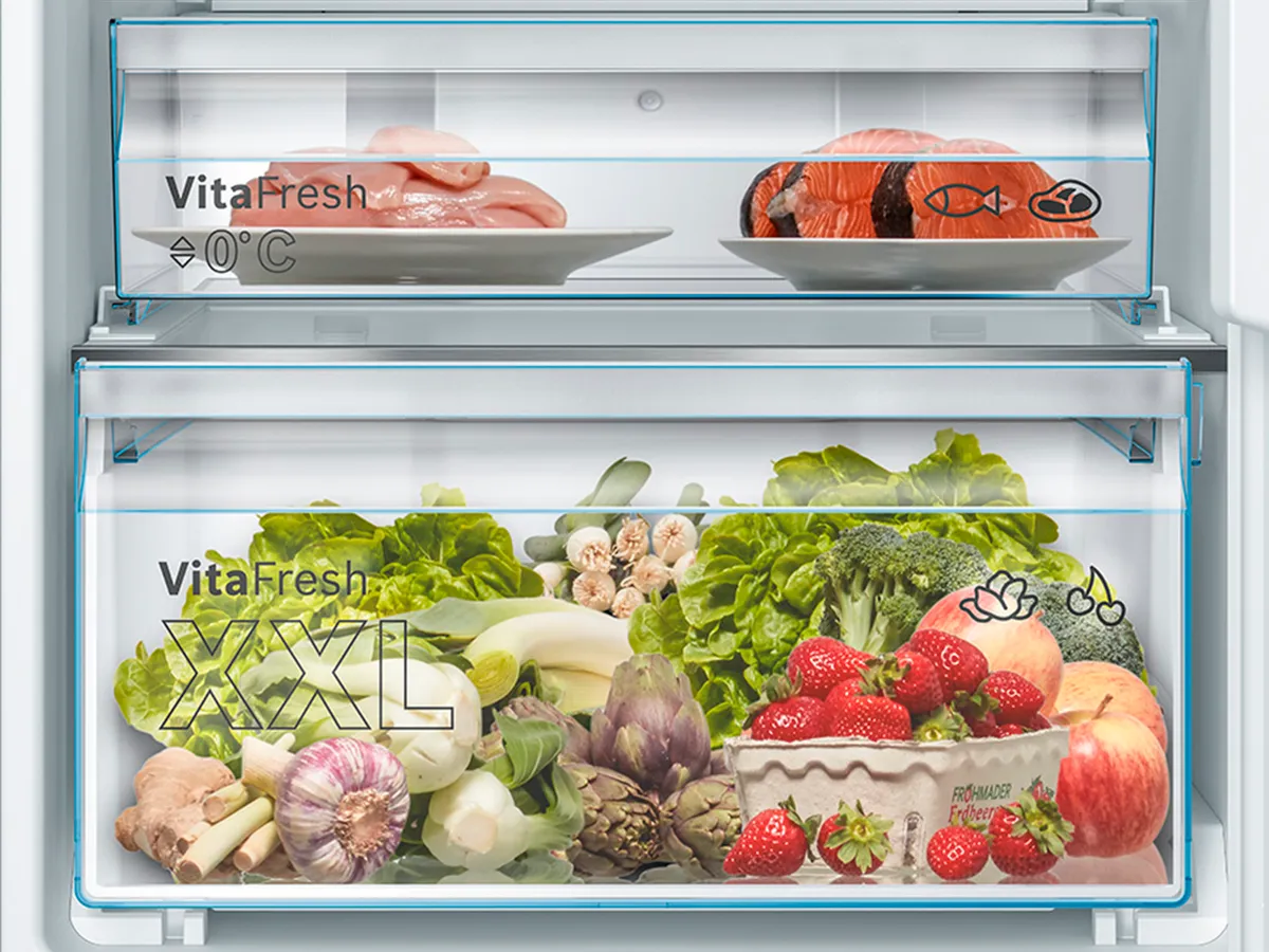 Open fridge with extra fresh vegetables in a VitaFresh XXL drawer.