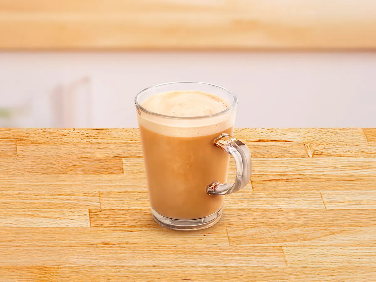 Glass cup filled with Café au Lait.