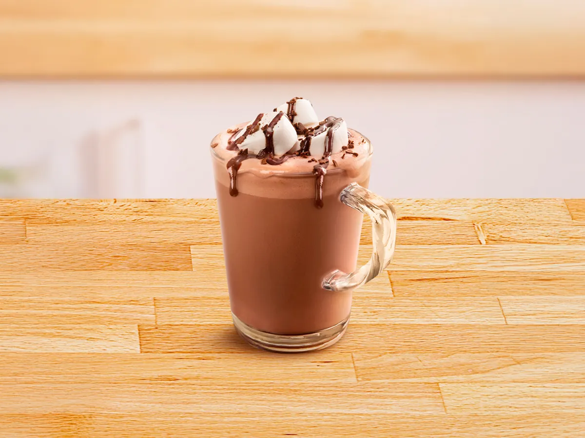 Glass cup filled with hot chocolate.