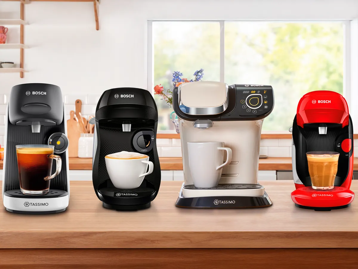 4 models of TASSIMO coffee machines on kitchen top, showing 4 different coffee specialities.
