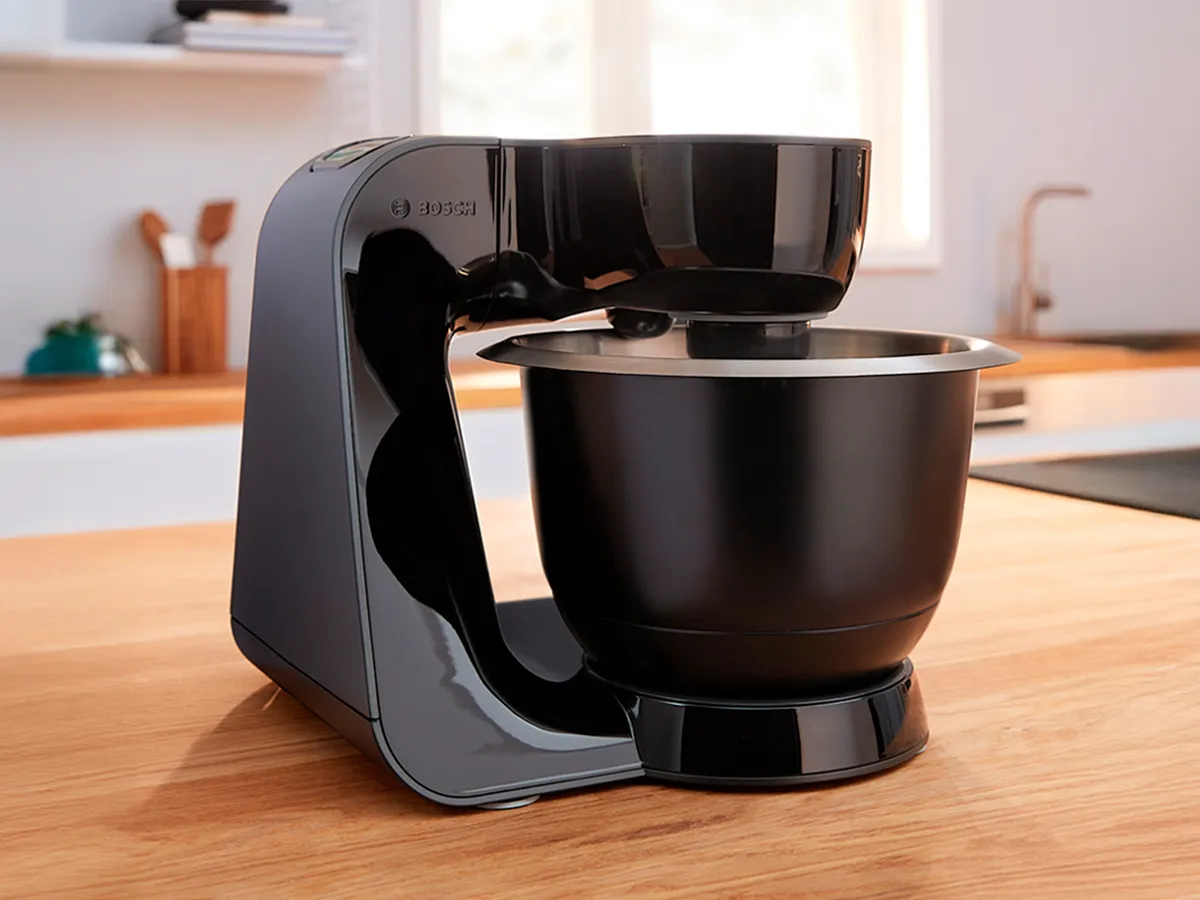 A black MUM5 stand mixer.