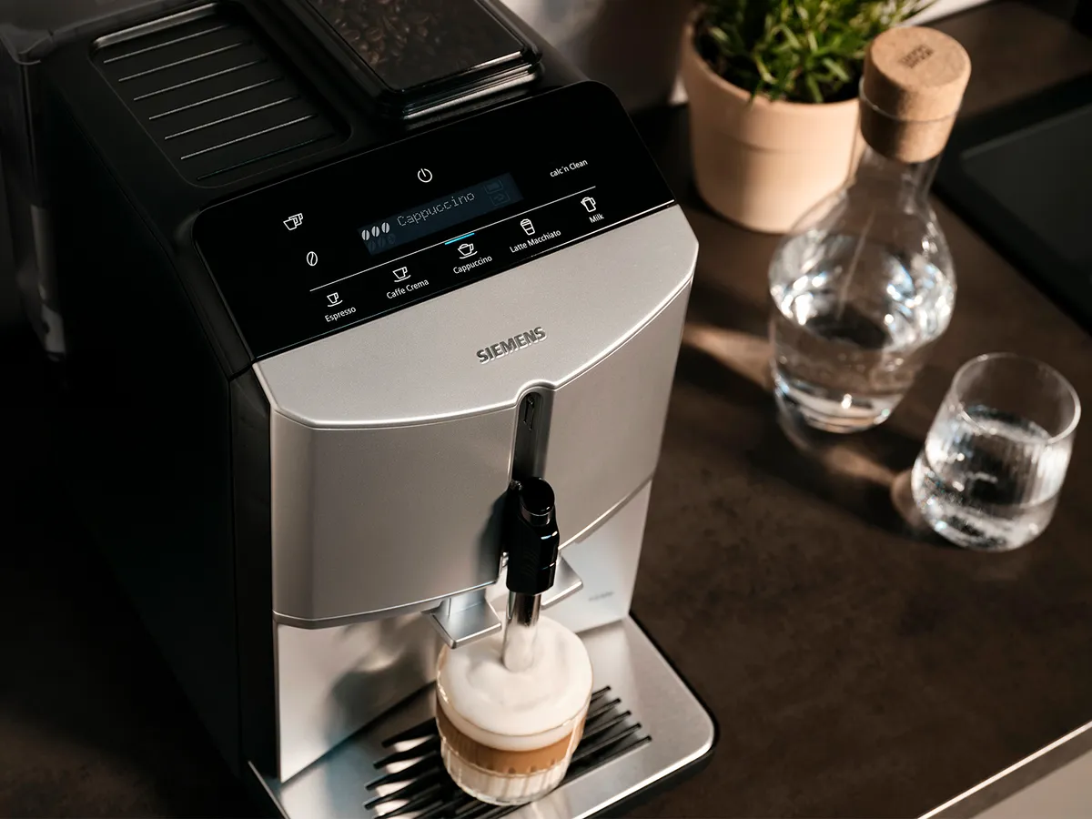 Display of the EQ300 fully automatic espresso machine, placed on a kitchen counter.