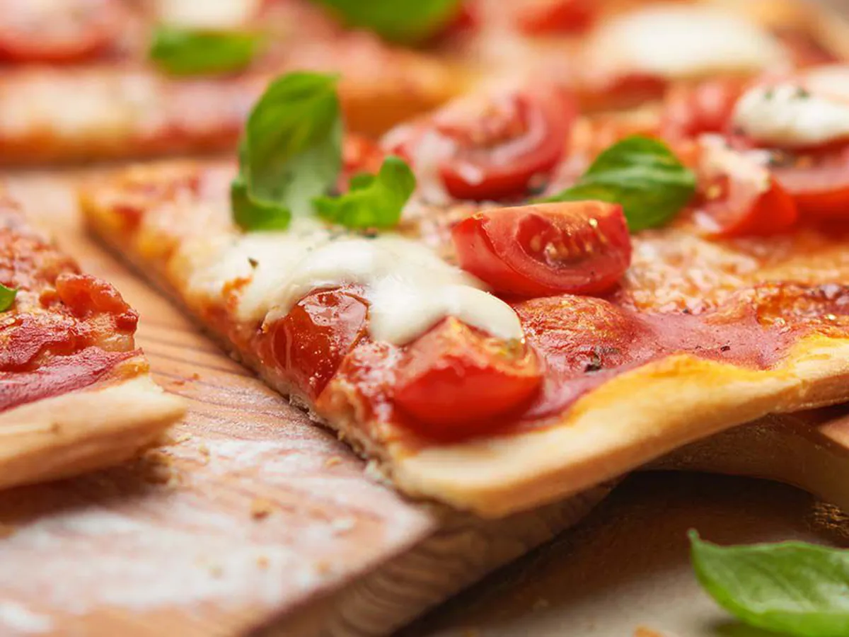 A taste of Italy: Pizza Margherita topped with basil and pecorino.