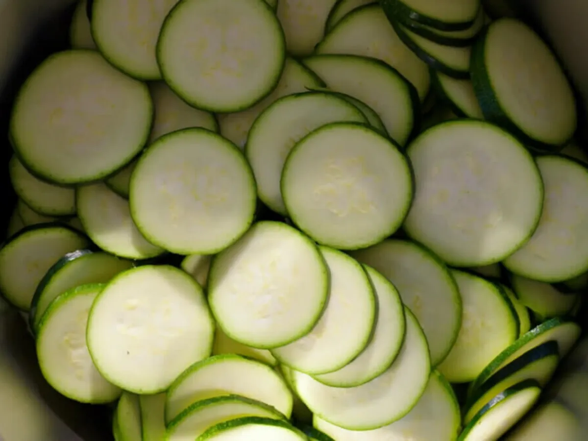 Top view of a cookit in which cucumbers sliced and grated.