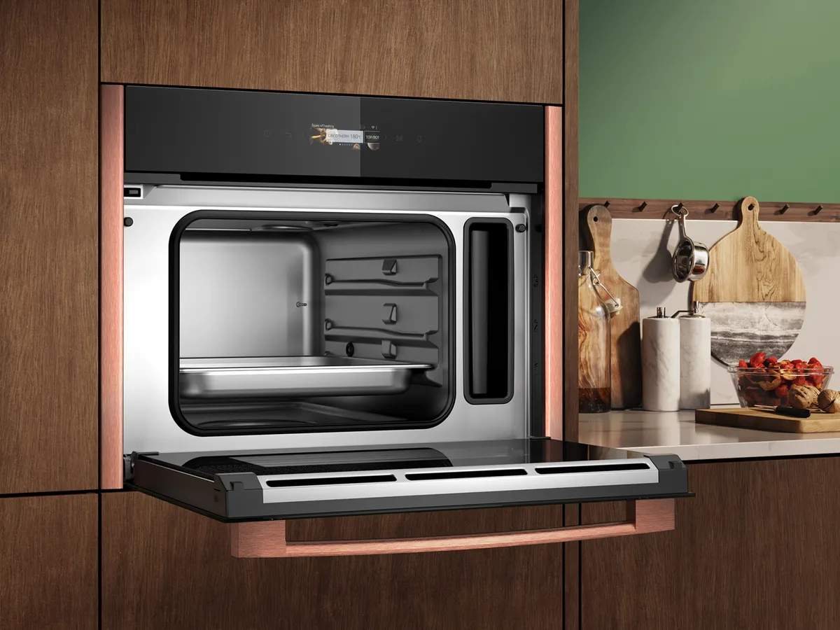 Steamer with Brushed Bronze side strips, shown with door open  