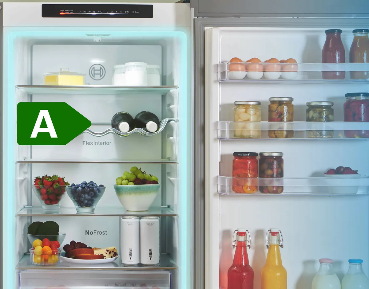 Open fridge freezer, fully stocked with A rated energy use icon
