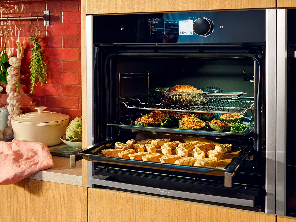 Slide & Hide oven, showing food on 3 levels, cooking without intermingling flavours 