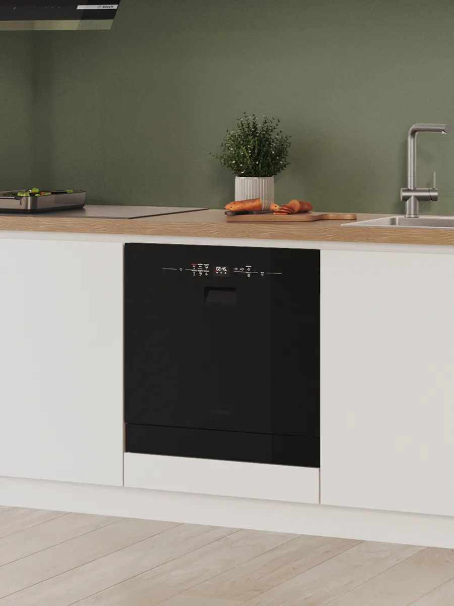 Small dishwasher built into cabinet