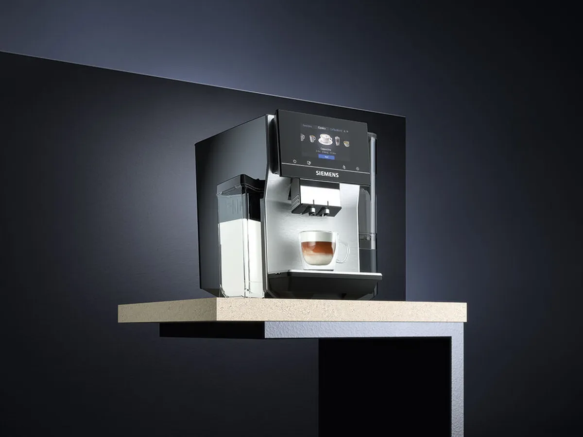 Siemens coffee machine on countertop against dark background