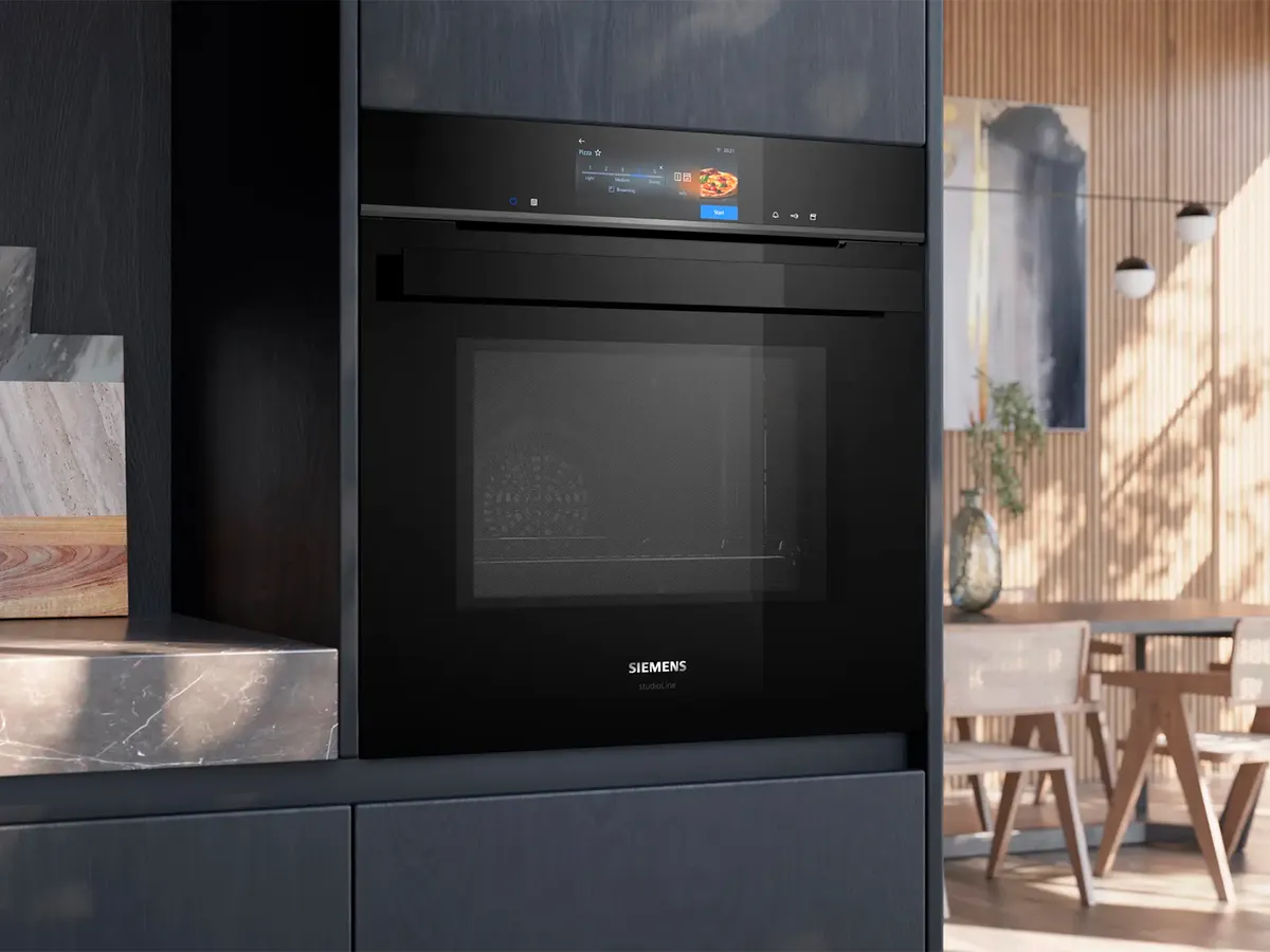 Built-in Siemens oven with microwave with digital display in a modern kitchen setting, featuring wooden accents.