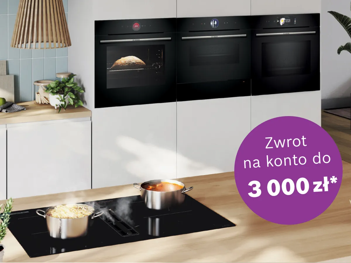 kuchnia z zabudowa piekraniki i płyta, na niej garnki