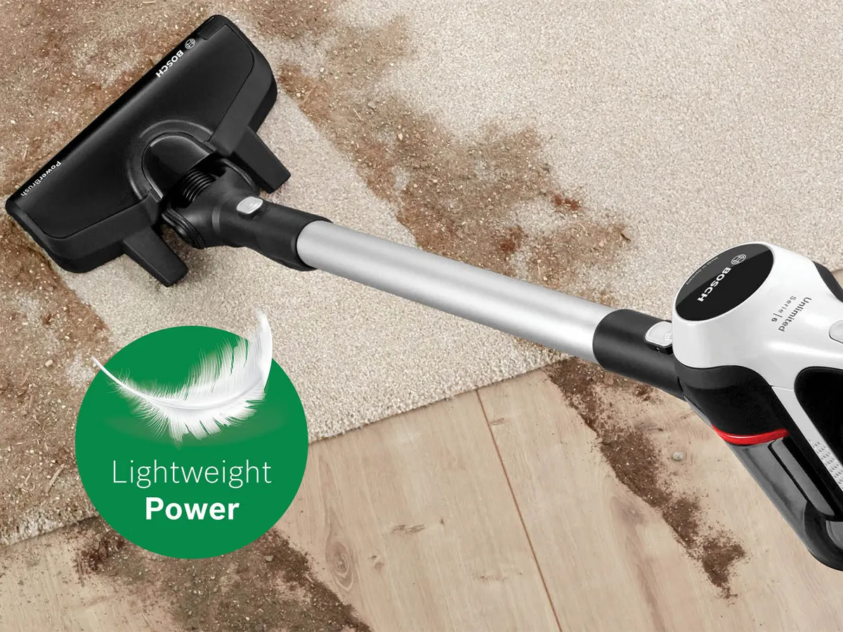 Unlimited 6 vacuuming dirt off floor with 'lightweight power' badge
