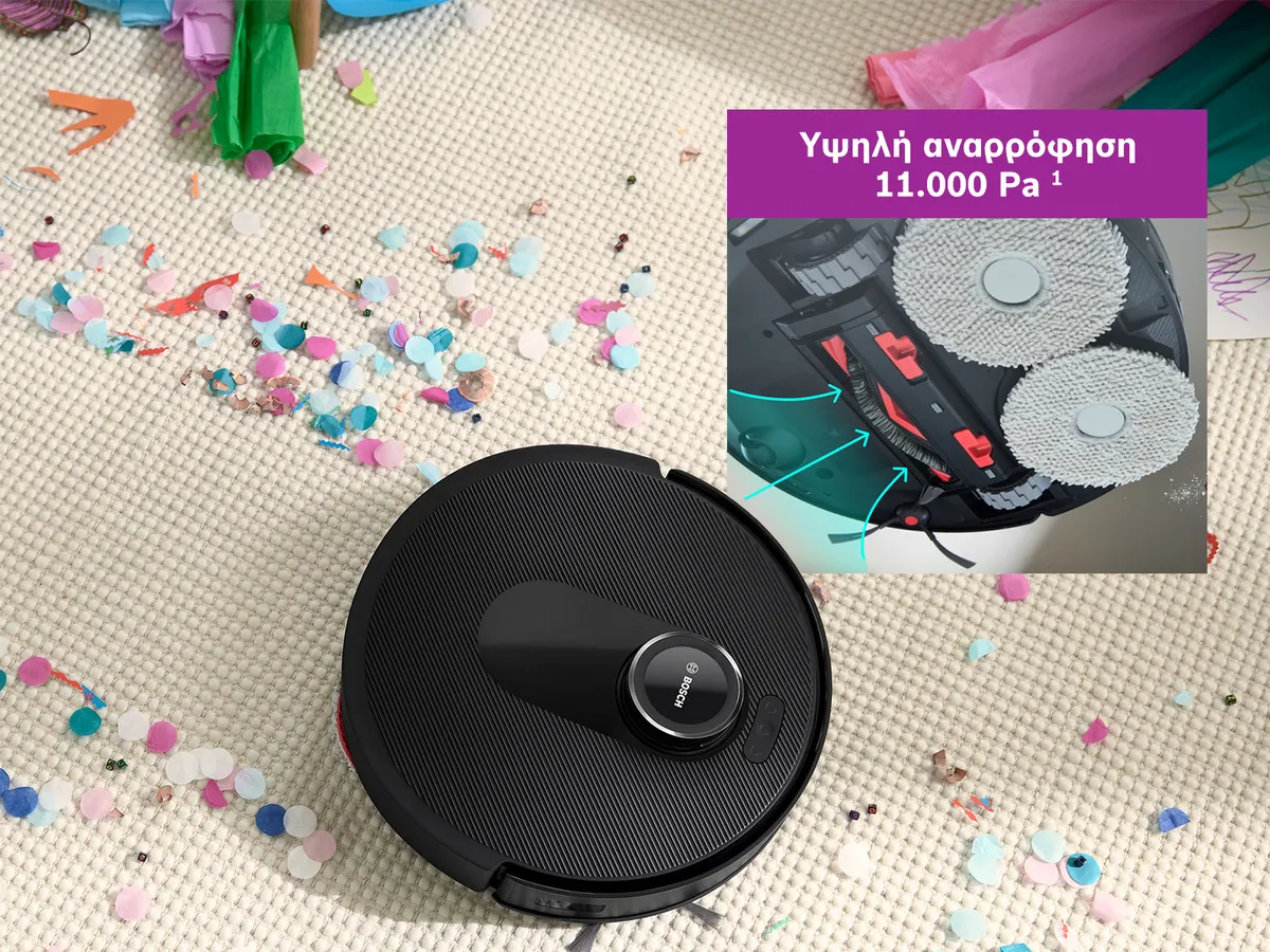 Η Spotless βρίσκεται πάνω σε ένα λευκό χαλί ανοίγει δρόμο μέσα από τα κομφετί, αποδεικνύοντας την ισχύ αναρρόφησης που διαθέτει.