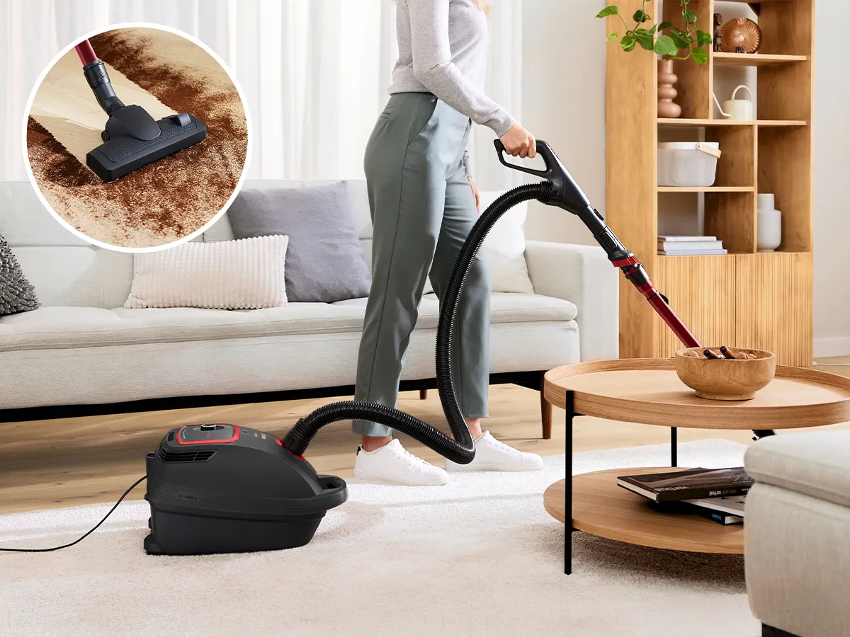 Bosch cordless vacuum with LED lights cleaning the floor.