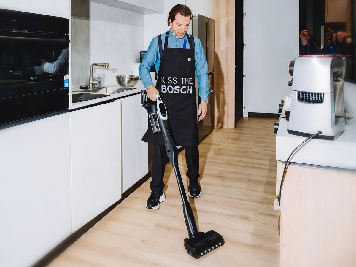 Chef Marcel using Bosch Cordless Vacuum Cleaner after cooking up a storm