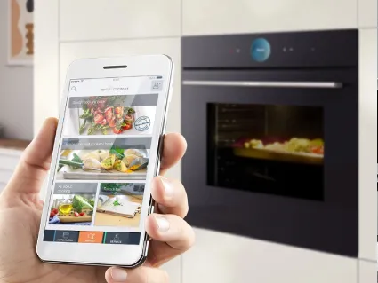 Sunlight filtering through lush green trees, symbolising Bosch's commitment to sustainability and environmental health.