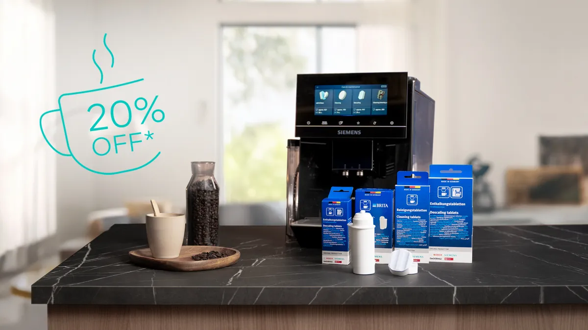 Siemens coffee machine with coffee care products on the counter.