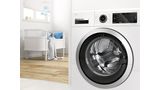 Bosch Waschmaschine mit Eco Silence Drive Motor, Kinderzimmer im Hintergrund